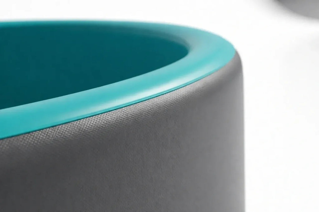 Close-up of charcoal grey pool wall and blue rim